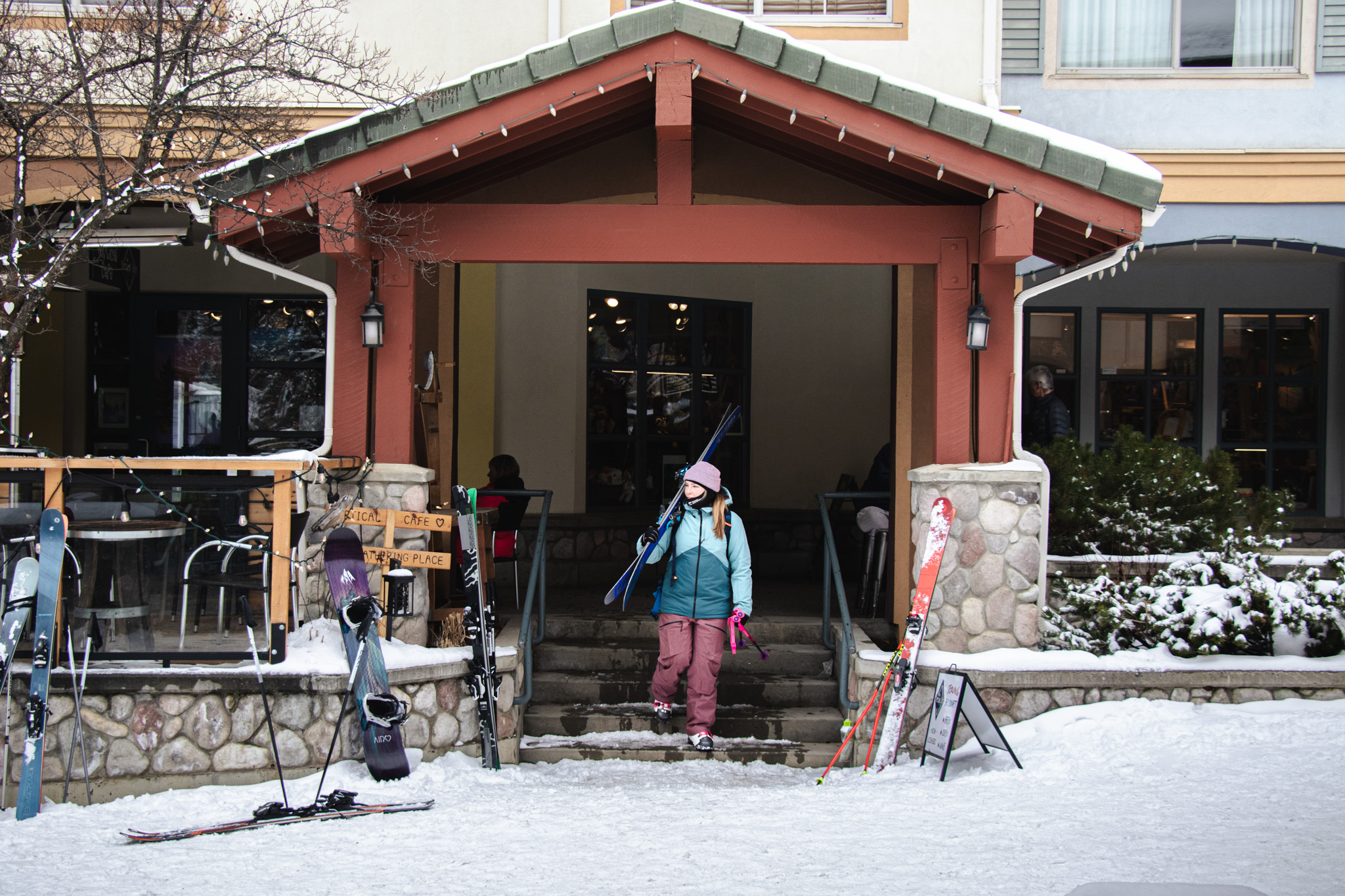Skier walking in Sun Peaks village