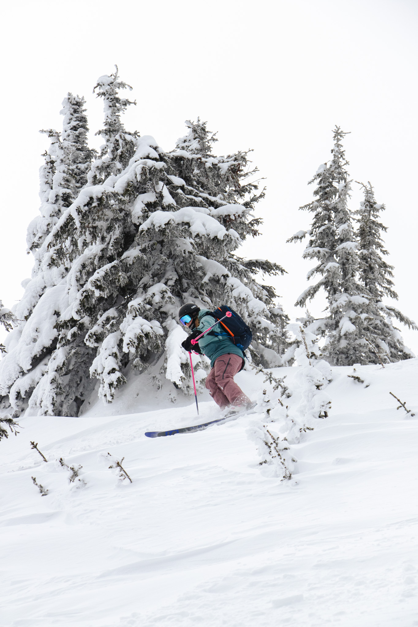 Skier skiing down slope at Sun Peaks Resort