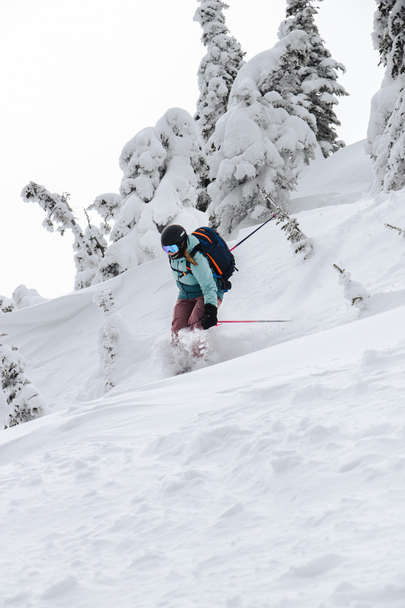 Skier skiing down slope at Sun Peaks Resort