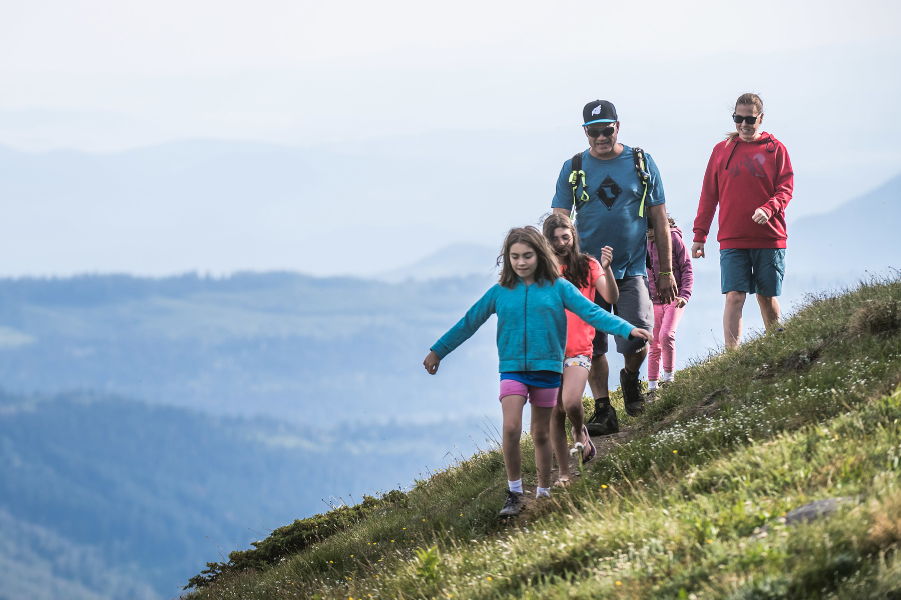 family hiking in sun peaks alpine