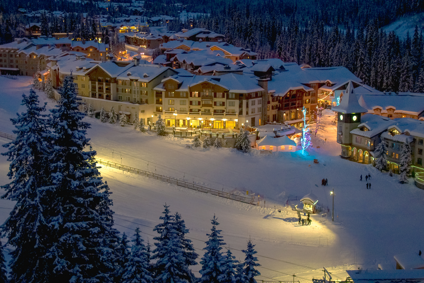 sun peaks village accommodation at dusk