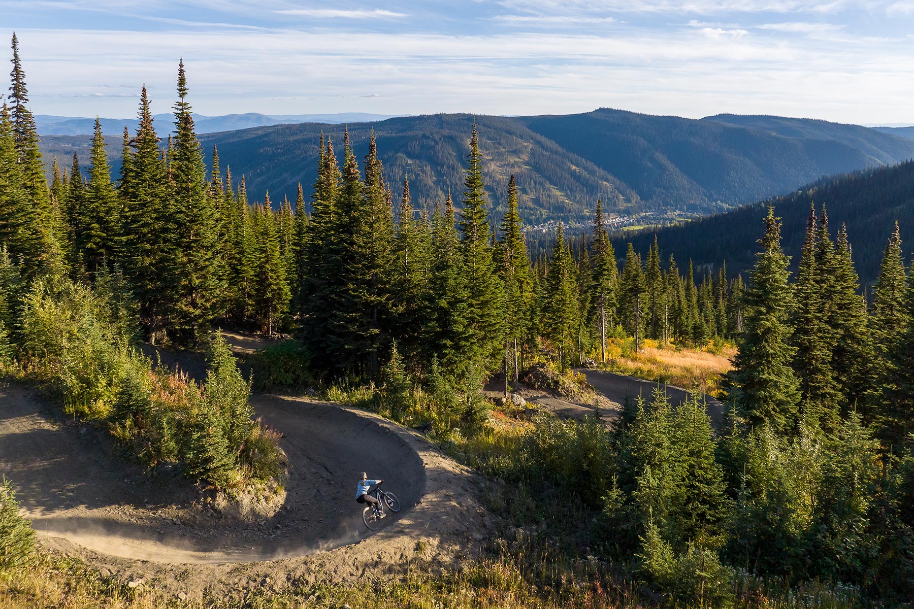 Downhill Mountain Biker riding a berm in the Sun Peaks Bike Park