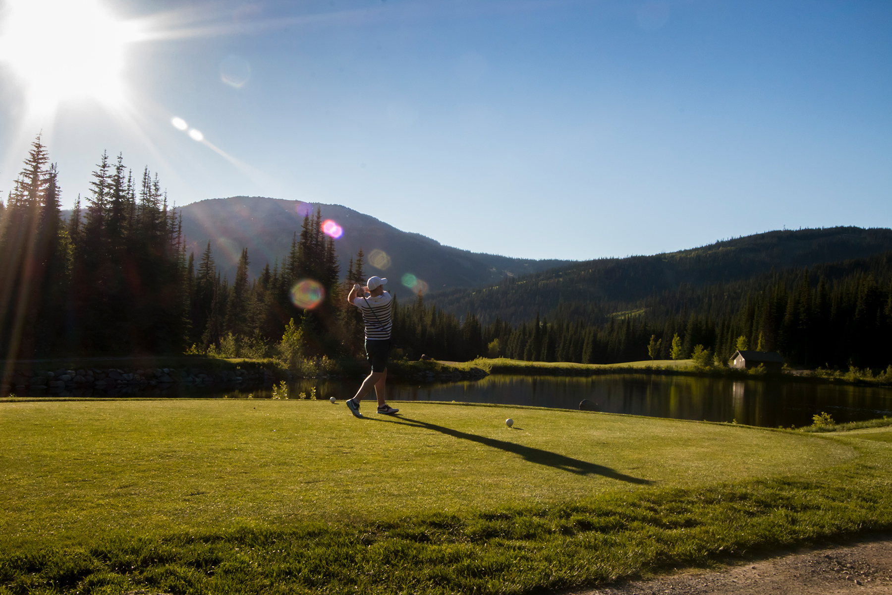Teeing off at The Golf Course at Sun Peaks Resort