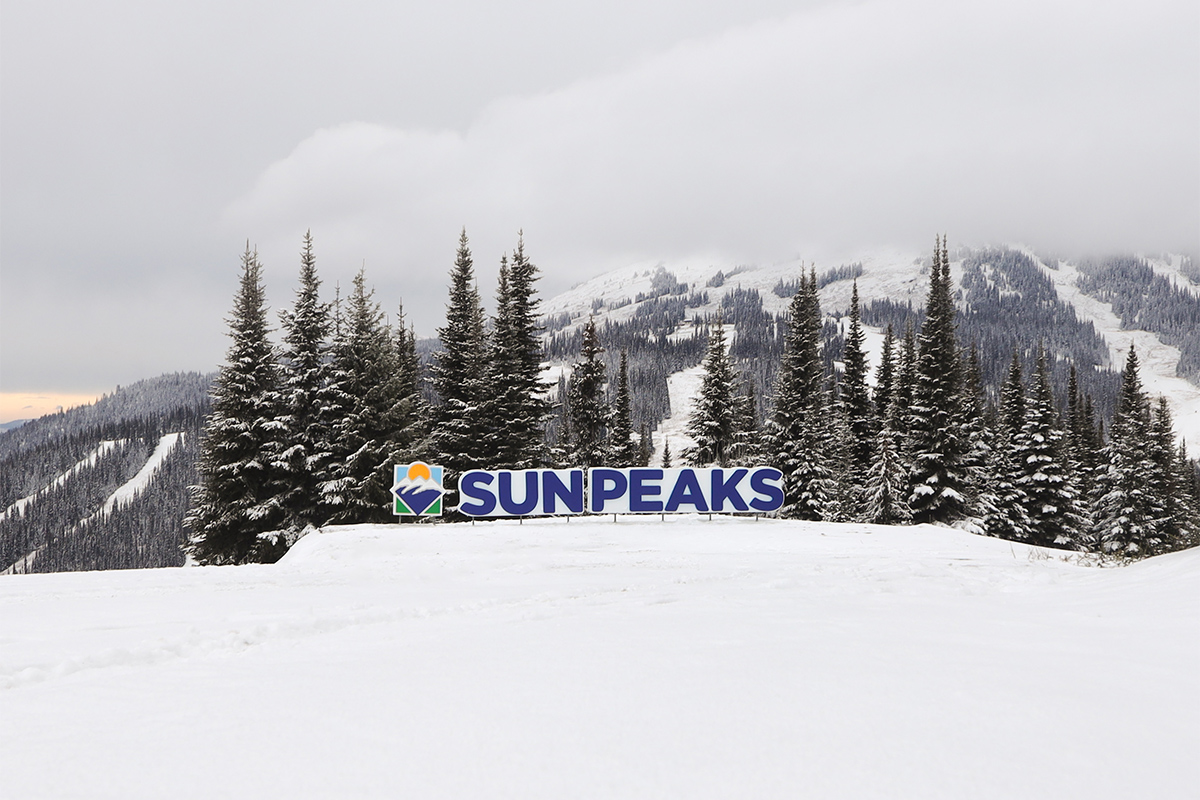 The new Sun Peaks sign sits atop of Sundance Mountain with a view of Mt. Tod in the background.