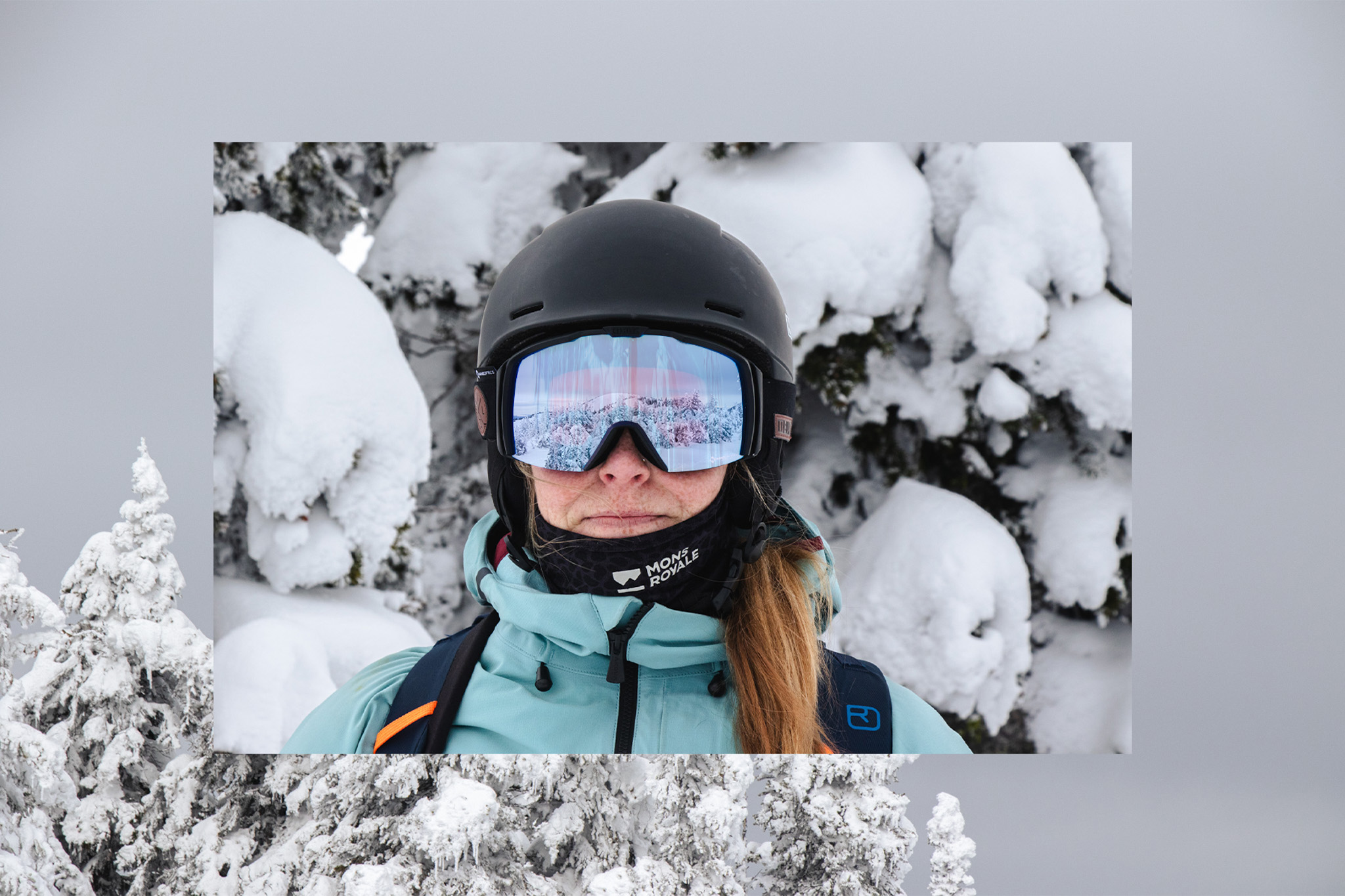 Skier having the reflection of a mountain and snow ghost in goggles
