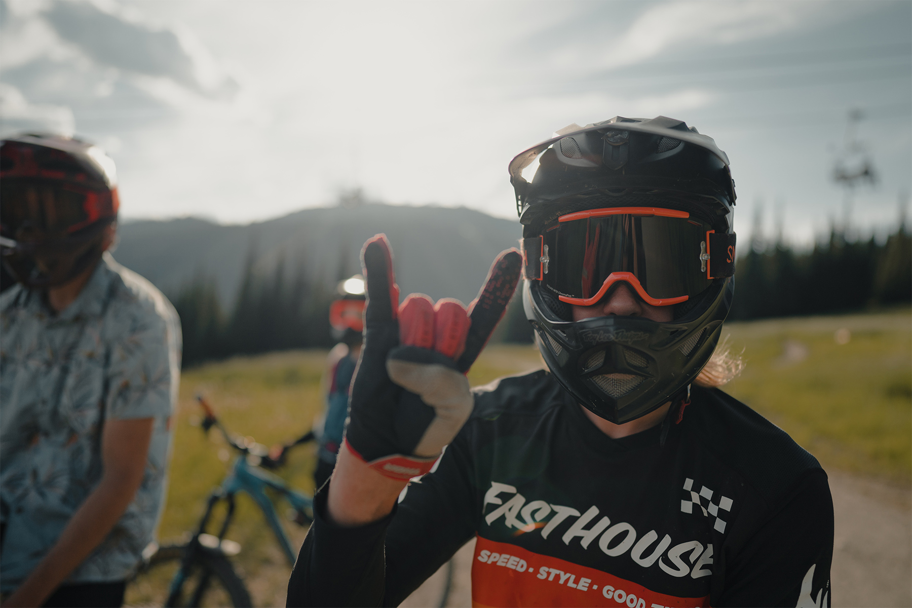 Mountain biker smiling for the camera under a helmet and goggles