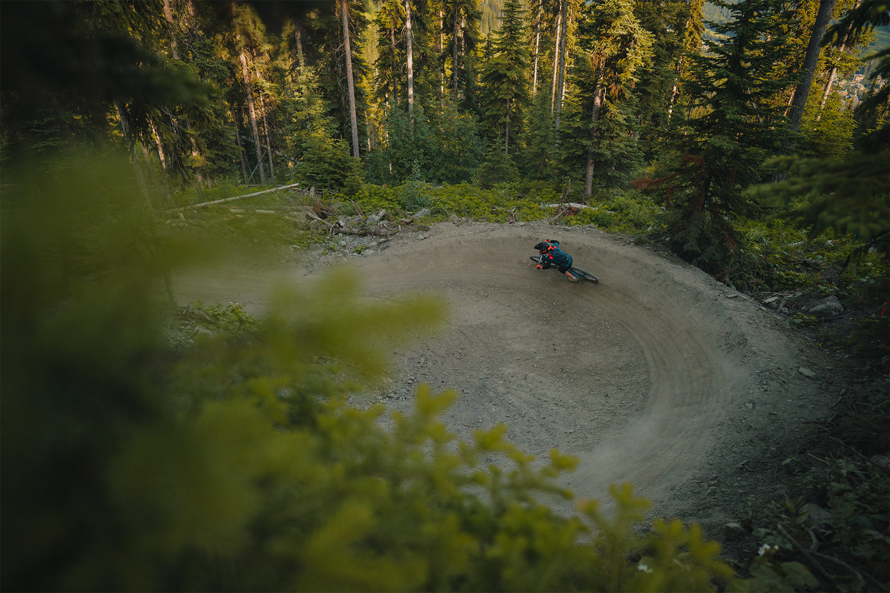 Mountain biker riding a berm, viewed from above