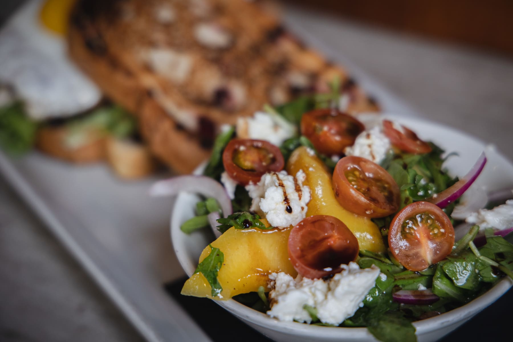 Brunch sandwich and fresh tomato salad at Cahilty Creek