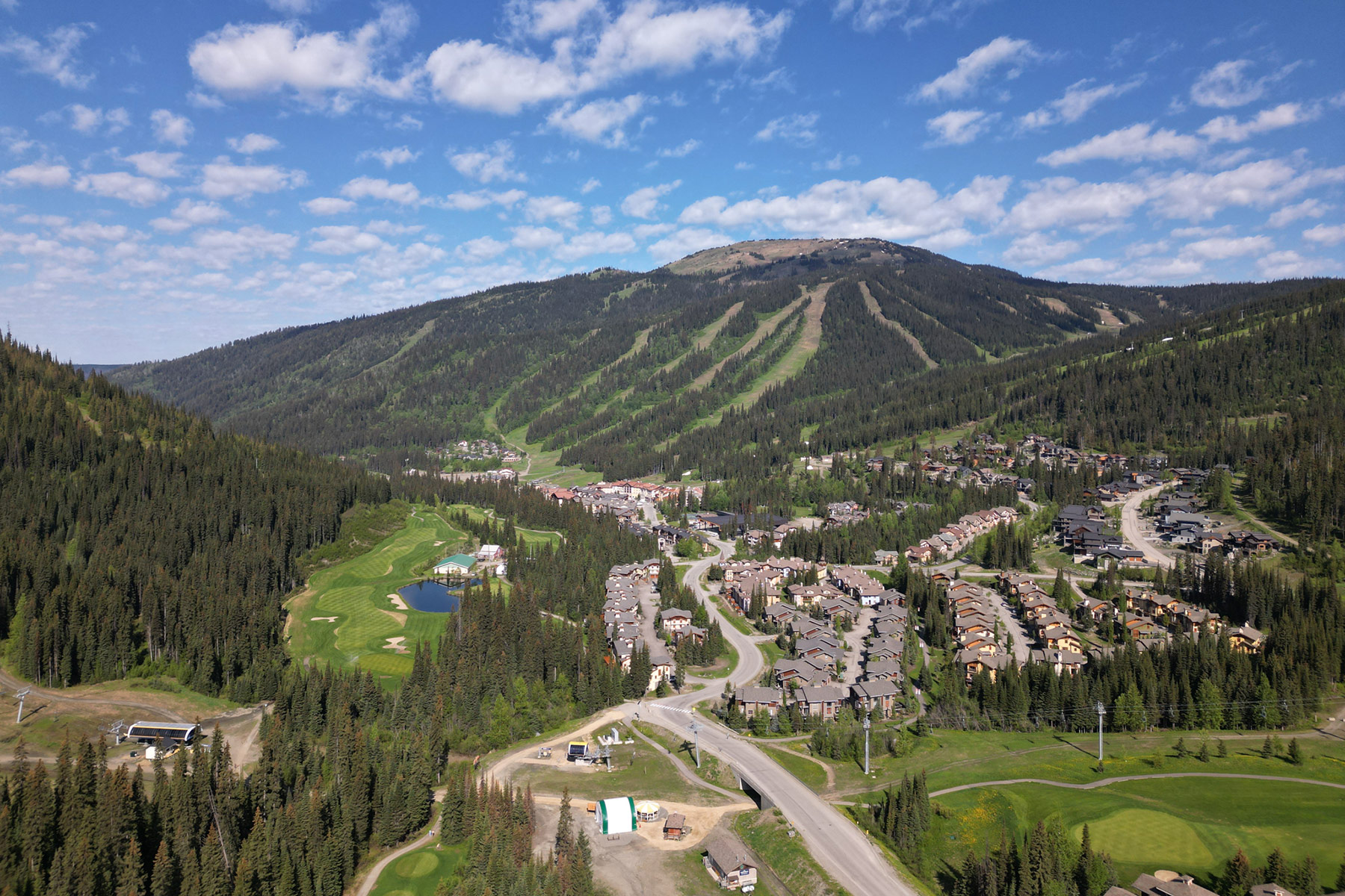Aerial shot of the Sun Peaks Golf Course with Mt. Tod in background