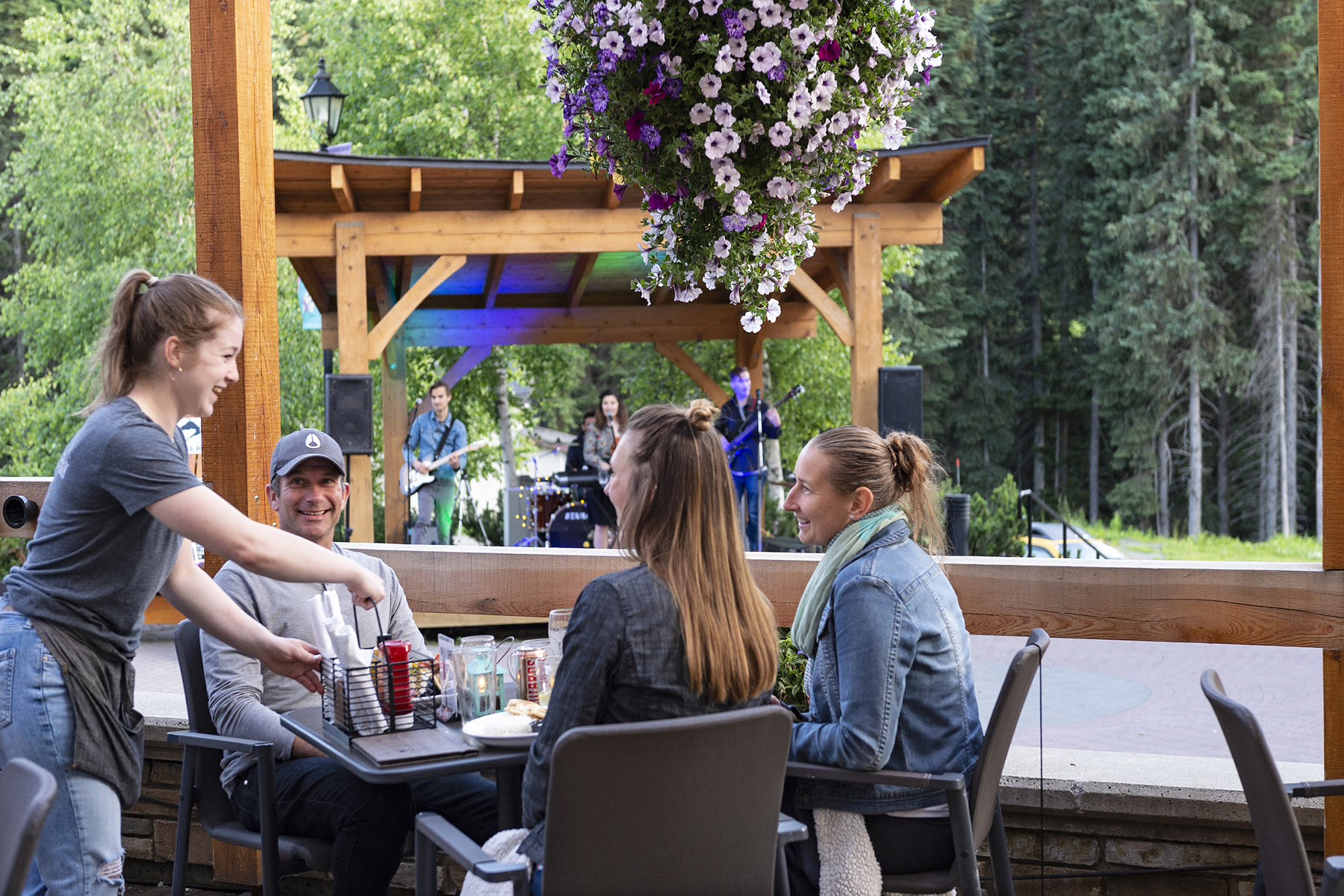 friends on patio with live music in sun peaks village