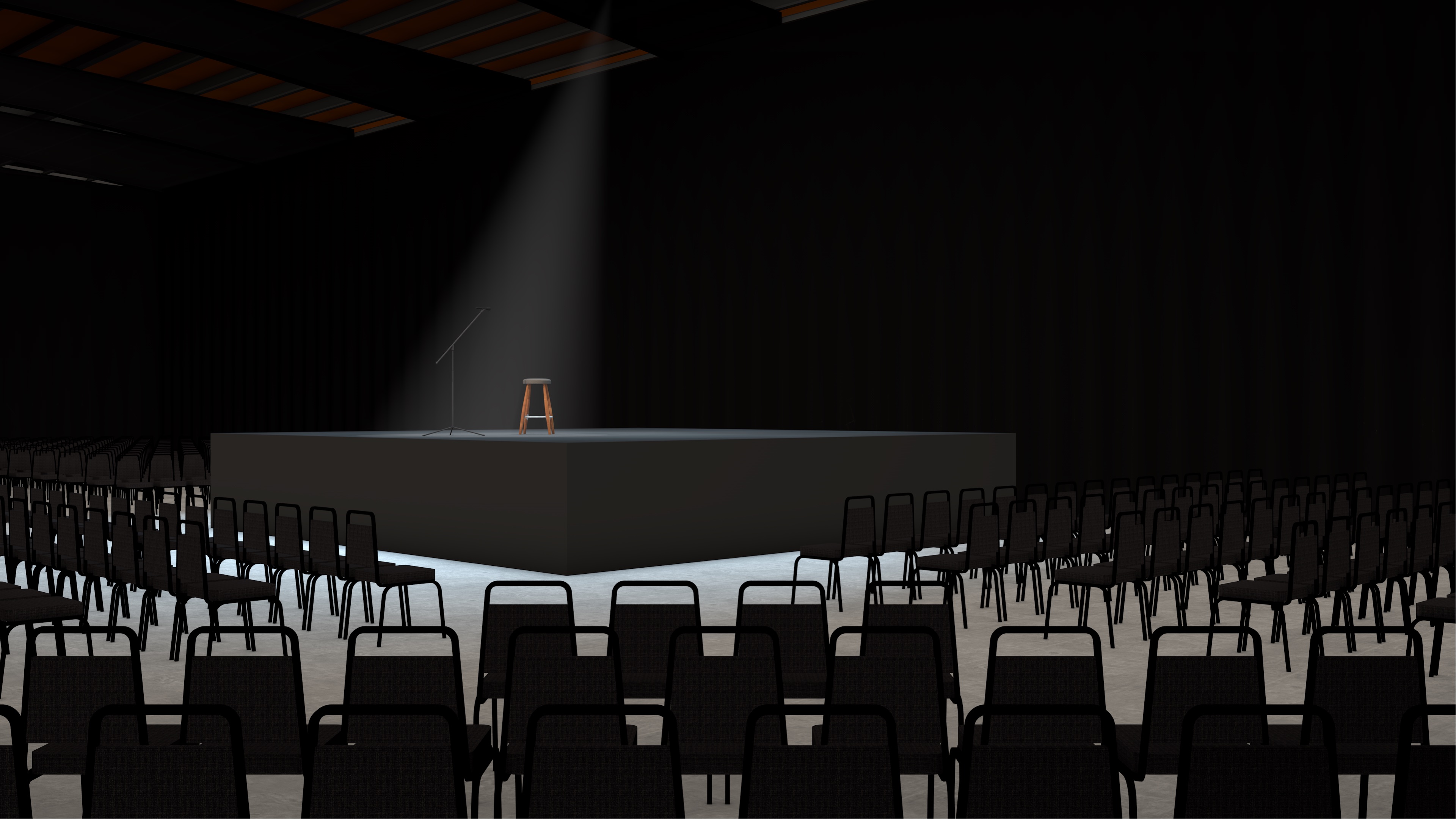 Concert venue mockup with a single stool in a spotlight.