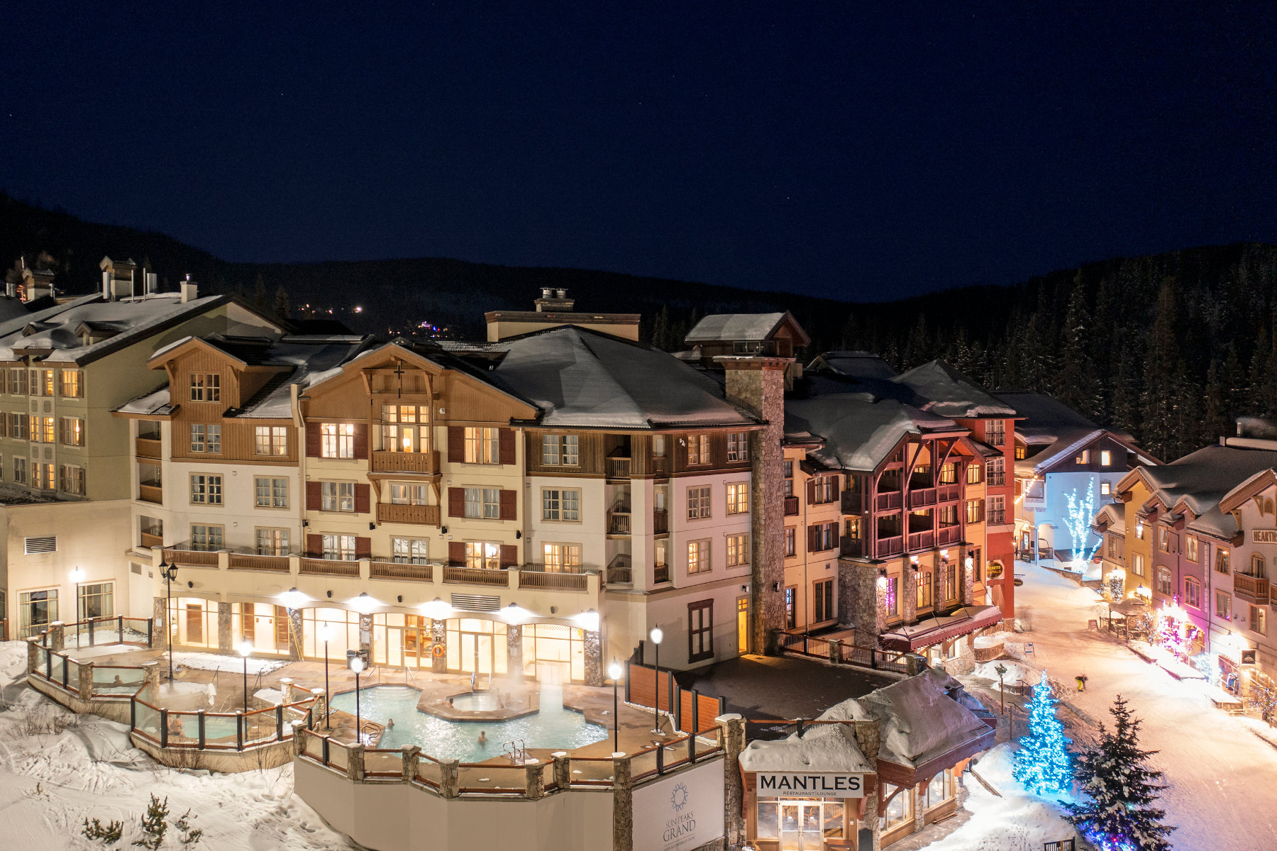 rand hotel outside view in the winter with snow and trees throughout the village