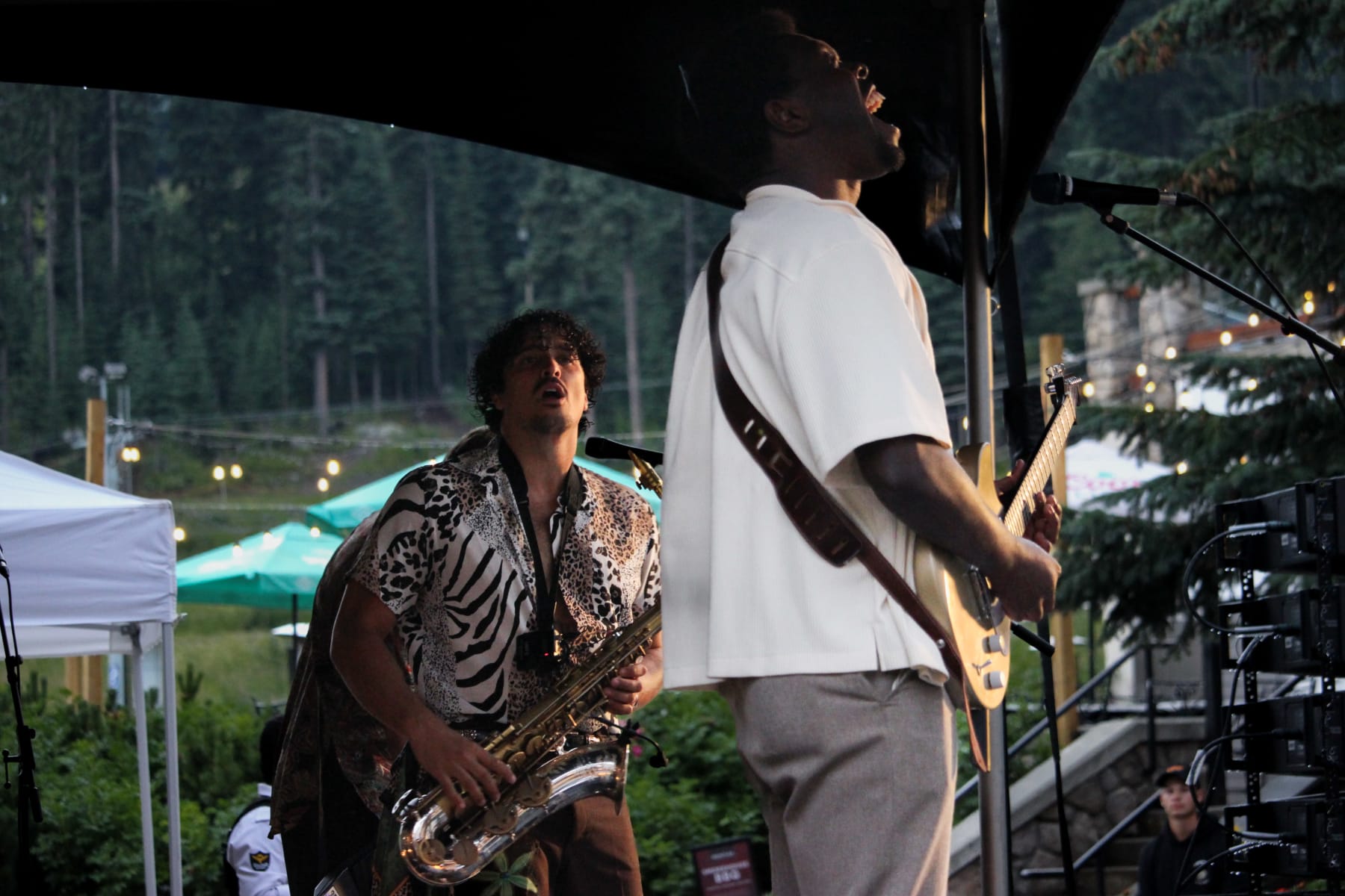 band with saxophone playing in Sun Peaks village in summer.
