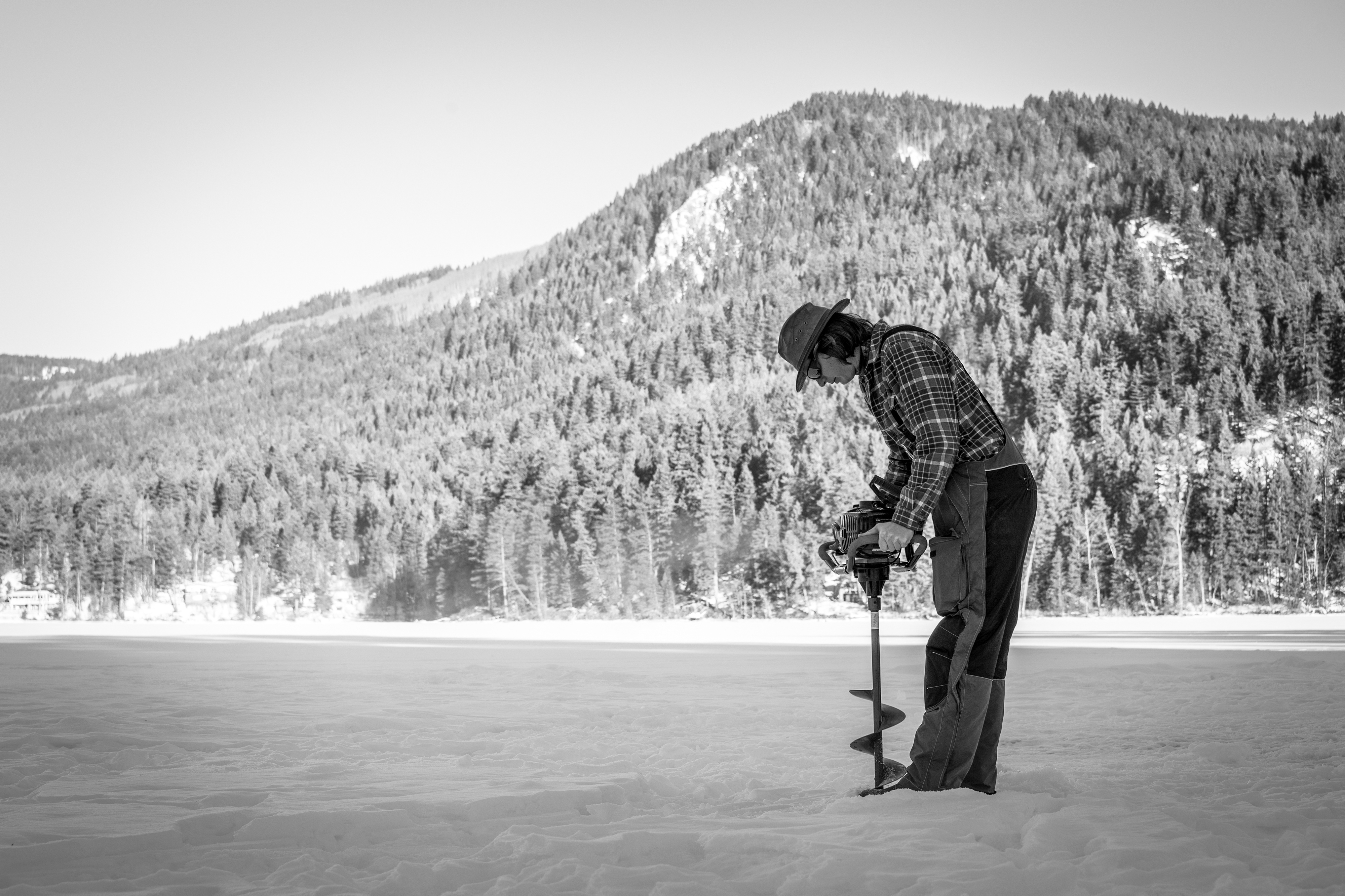 Drilling a hole to fish