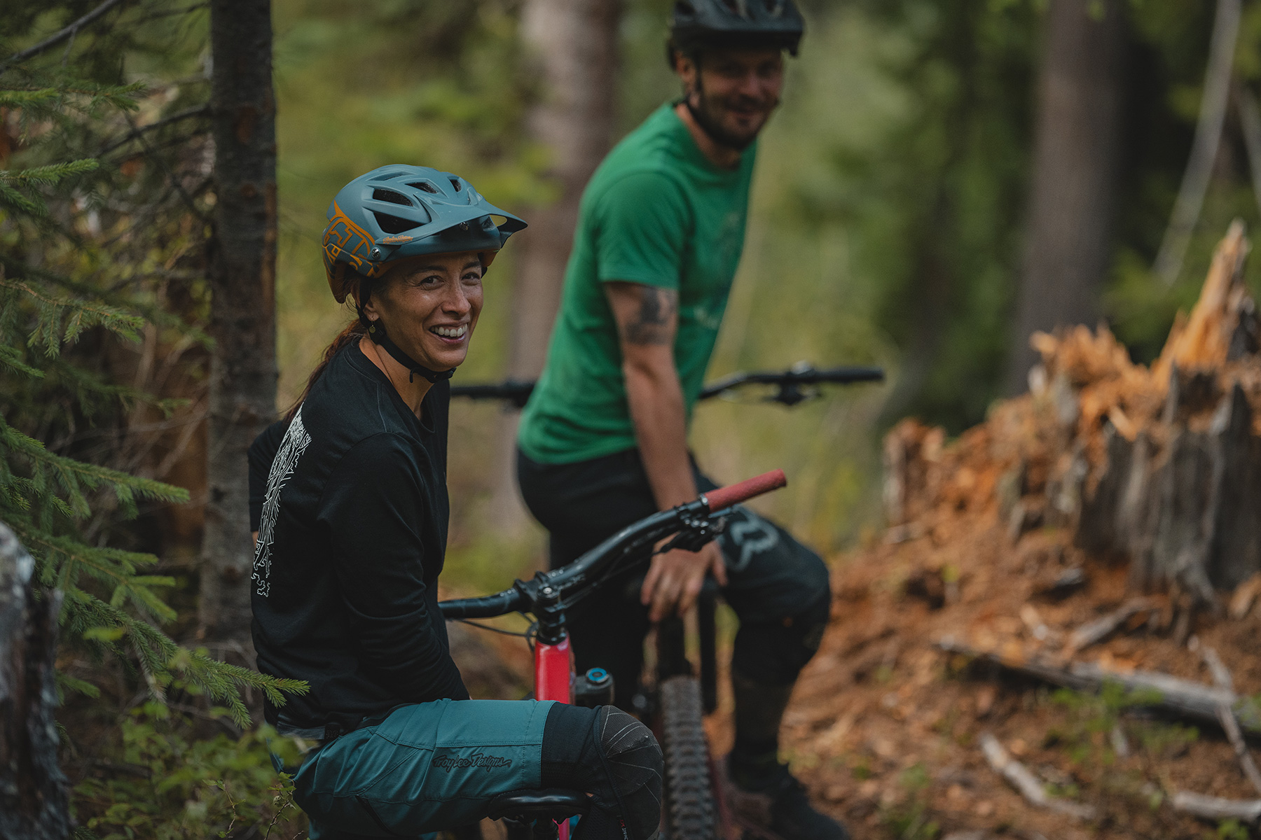 Kelly Kozevnikov smiling at camera while riding on Mt. Morrisey