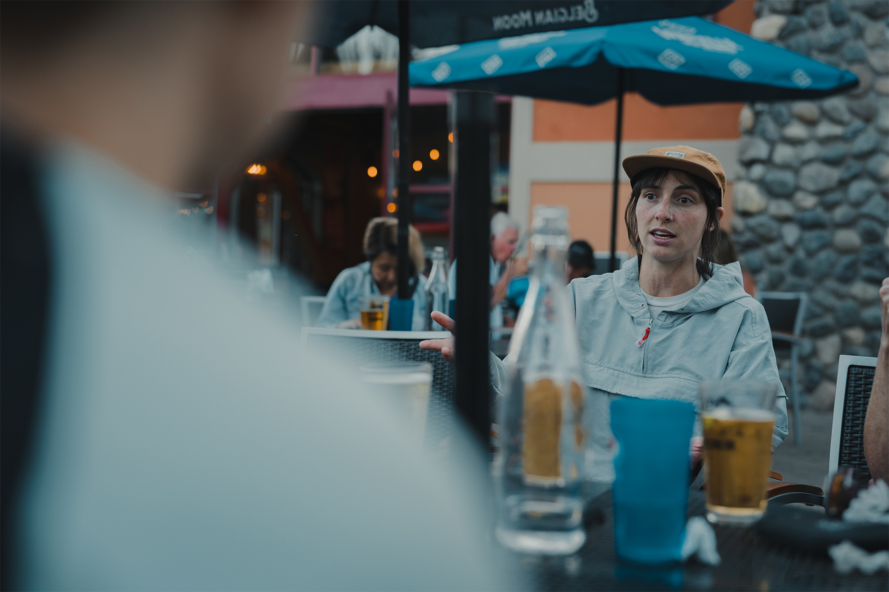 Lacee sitting at a table on a restaurant's patio 