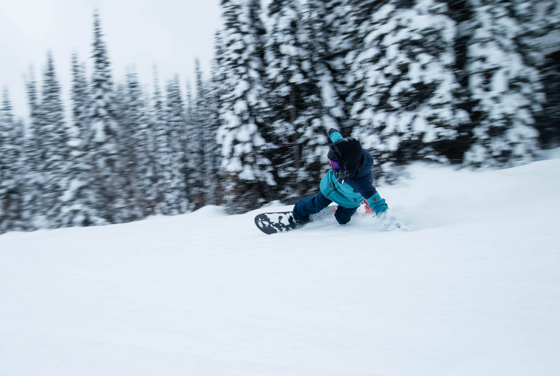 Marlie carving wide in sun peaks