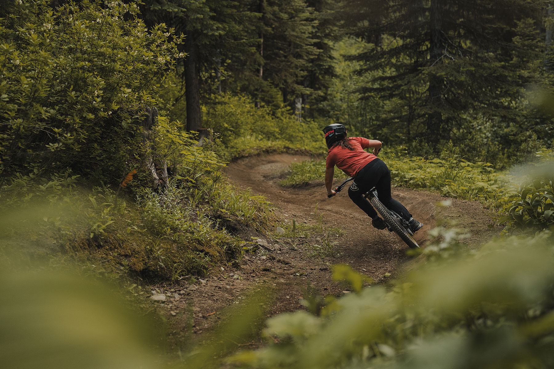 DH rider cornering at Sun Peaks Bike Park