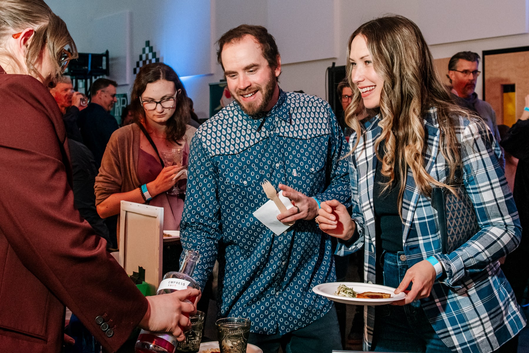 Kyle and Julia enjoying a beverage and food provider at the Epicurean.