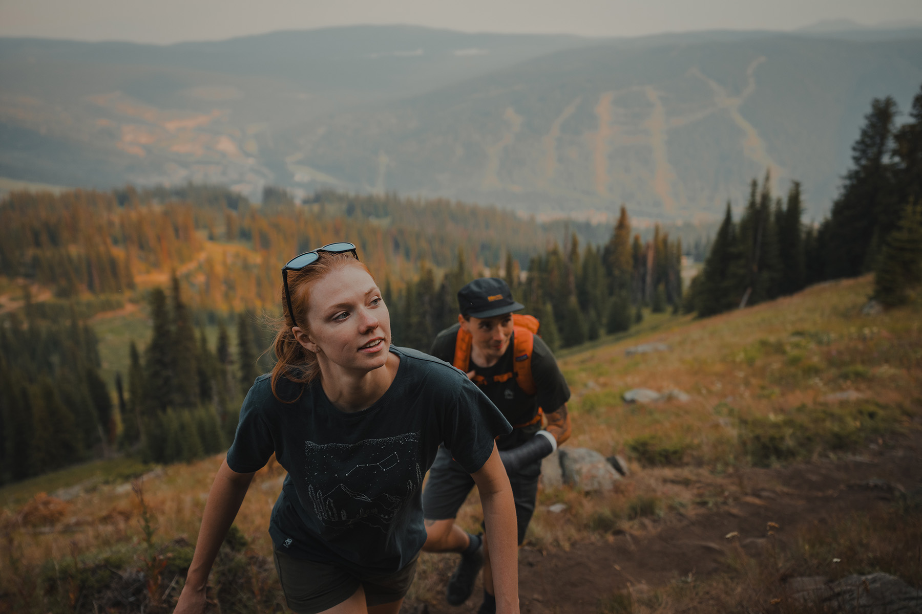 Couple hiking to the top of Sun Peaks