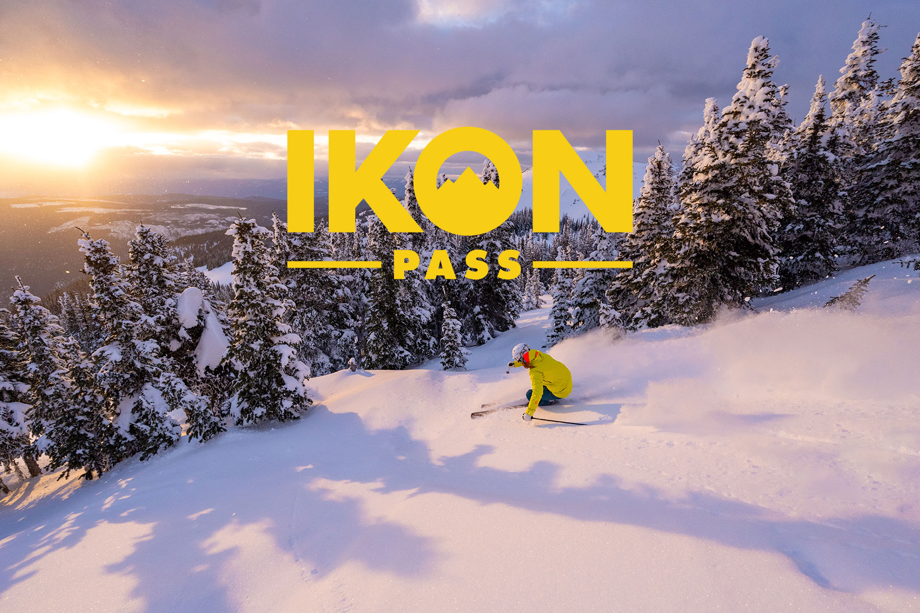 Ikon Pass Logo Overlaid On Skier In Powder In Sun Peaks
