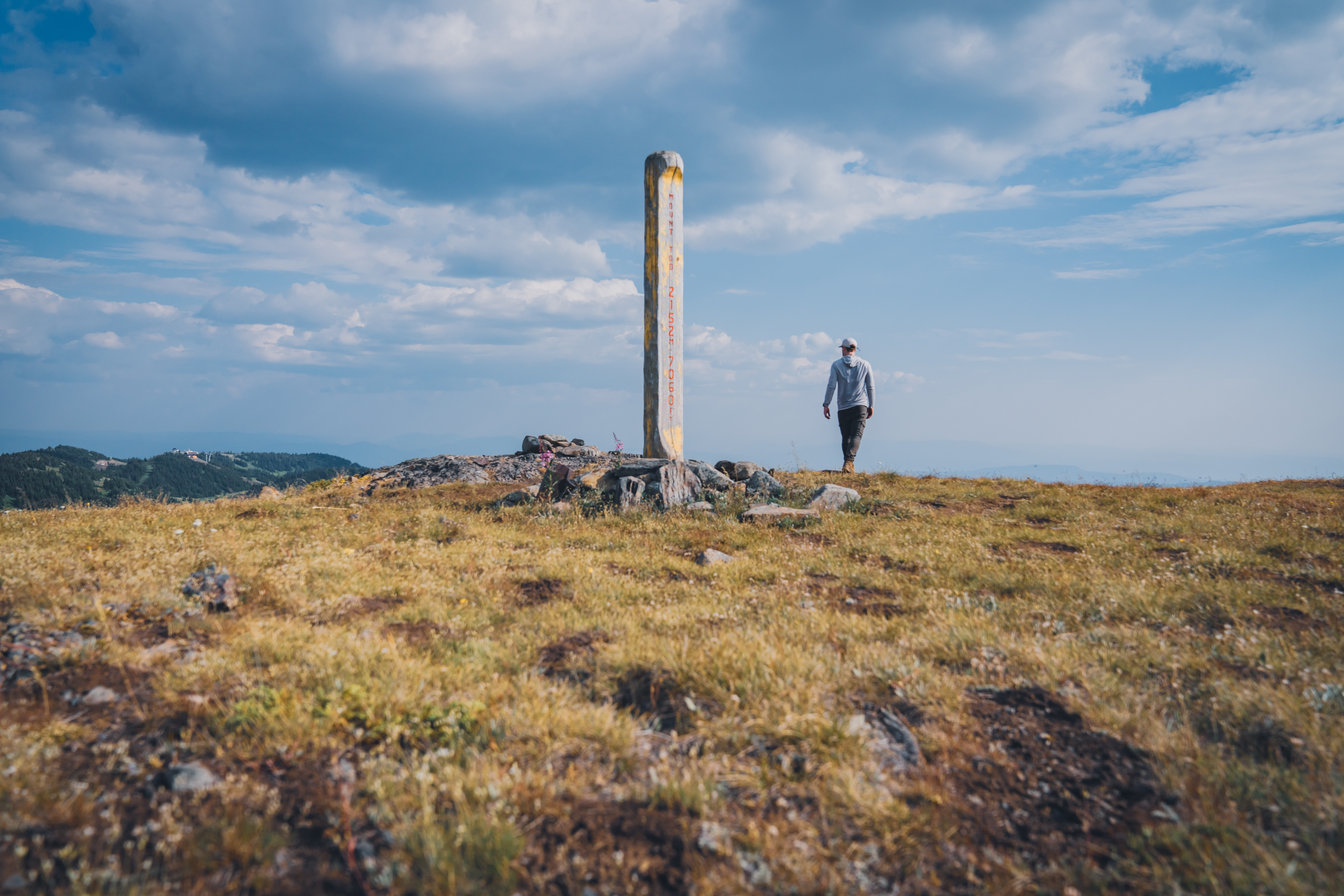 Man standing on top of Tod Summit up at Sun Peaks Resort