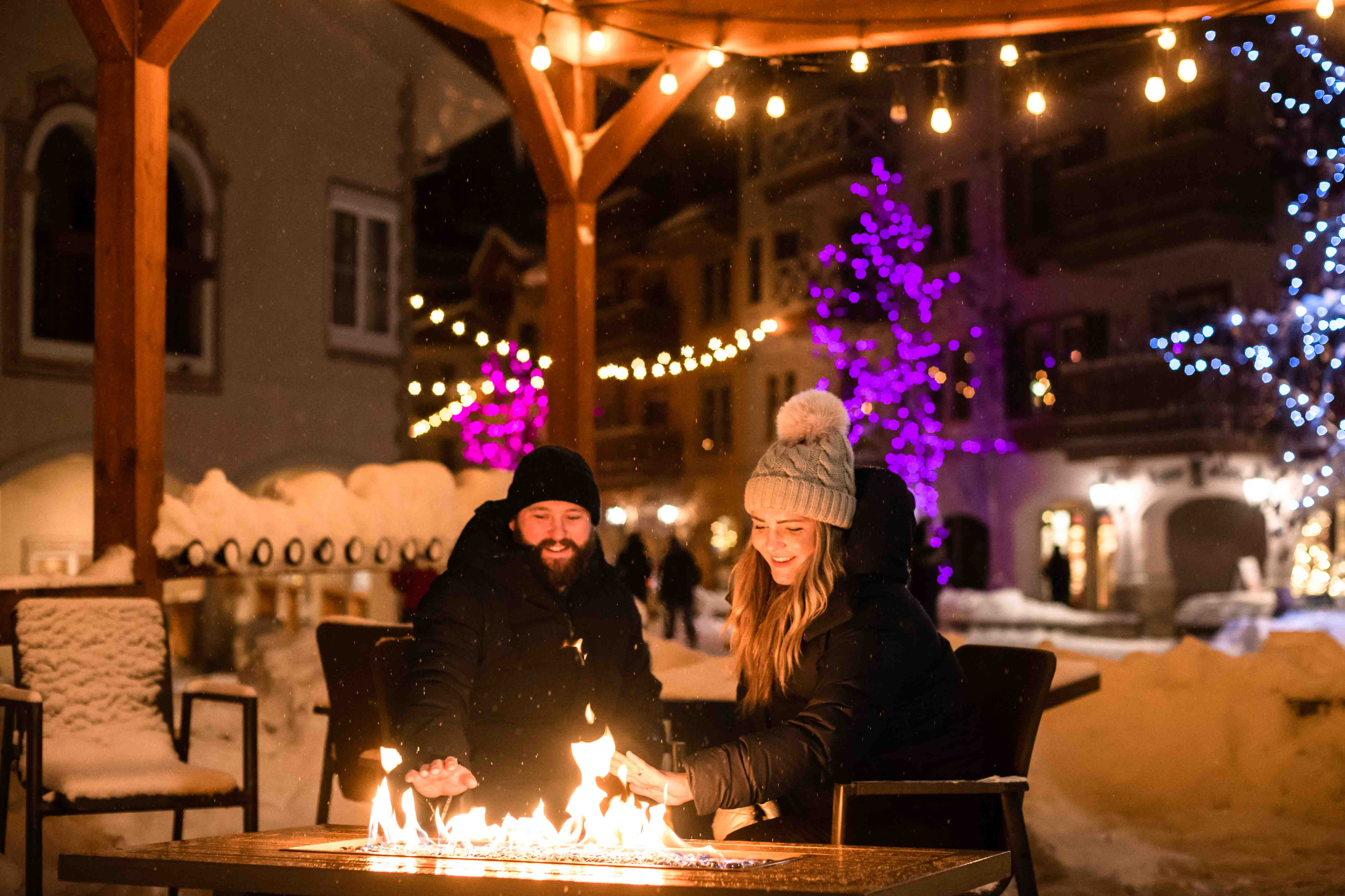 couple warming up in sun peaks village