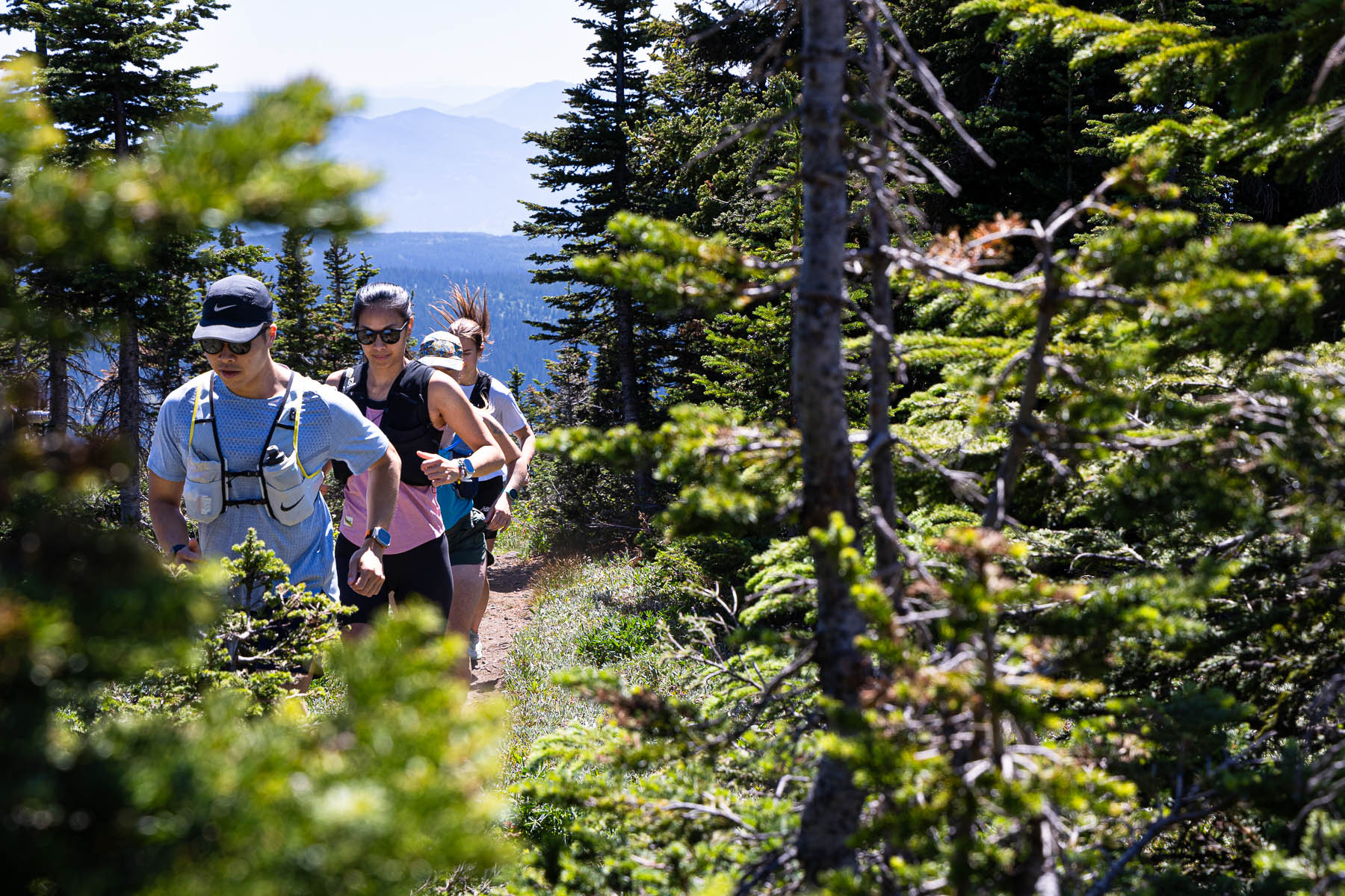 trail runners in forest
