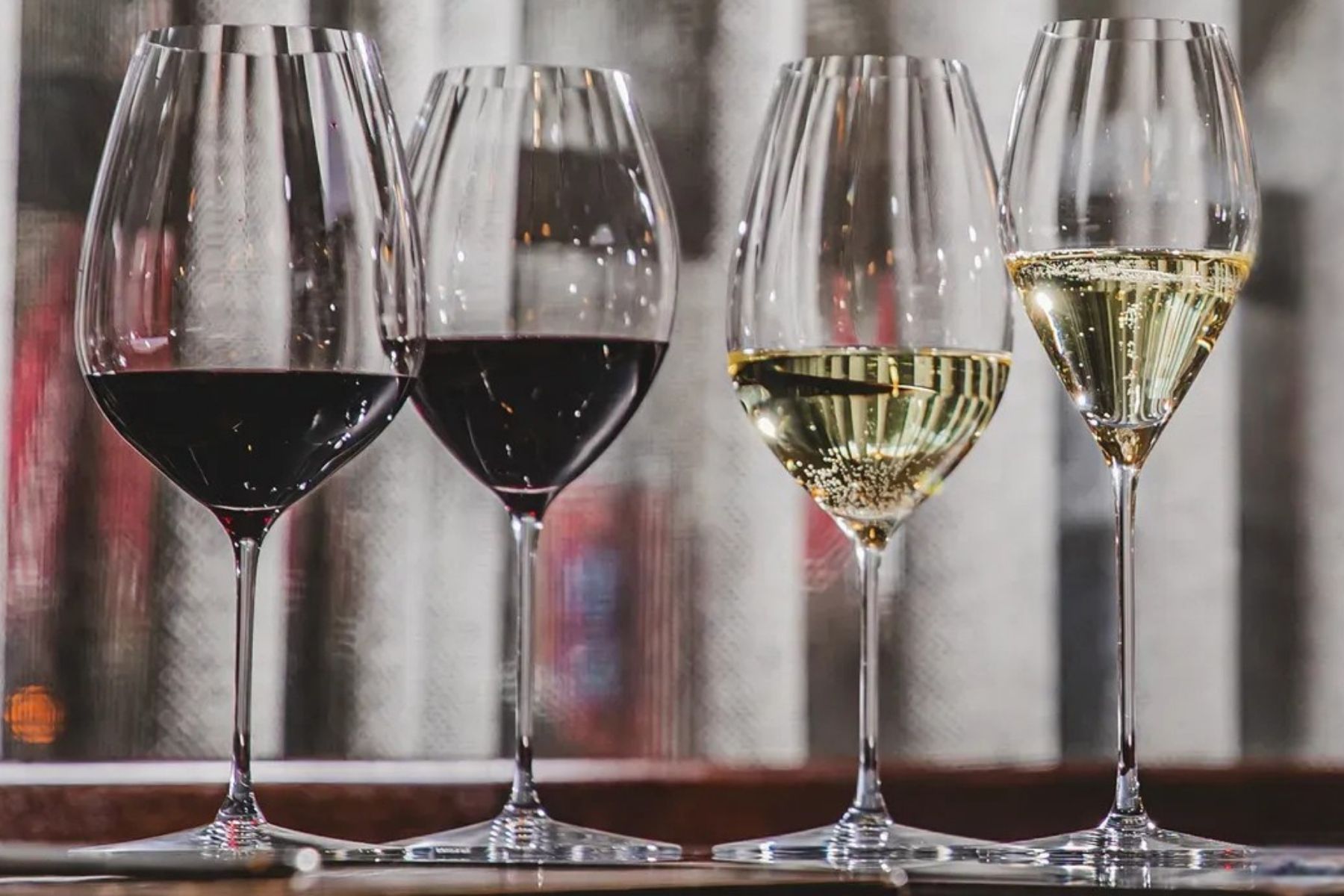 Four wine glasses with red and white wine.