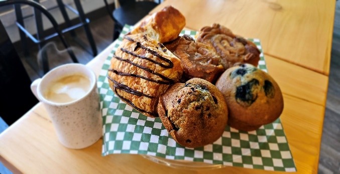 basket of baked goods and coffee