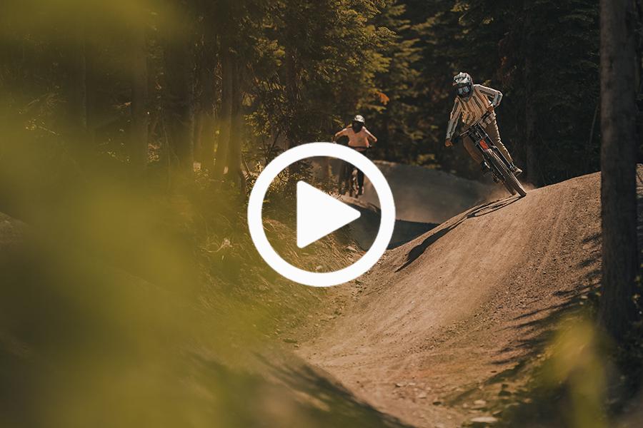 Two riders on a flow trail at Sun Peaks Bike Park