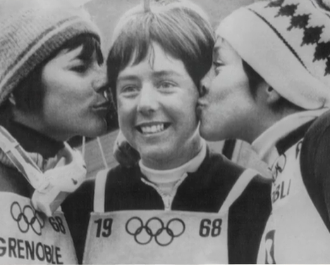 Black and white photo of Nancy Greene getting kissed on the cheek