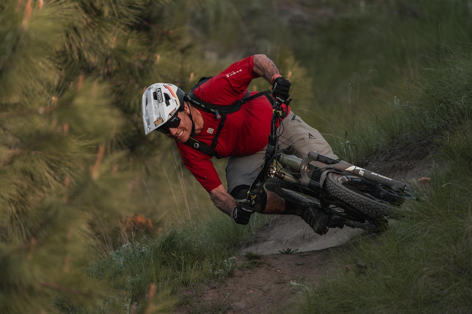 Biker riding down a steep trail
