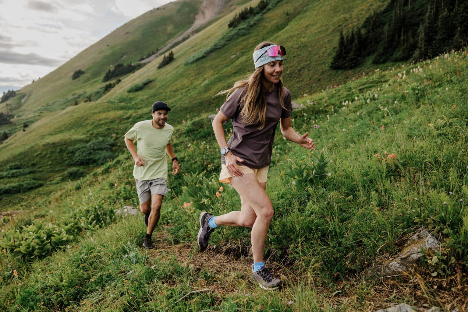 two people trail running on the mountain