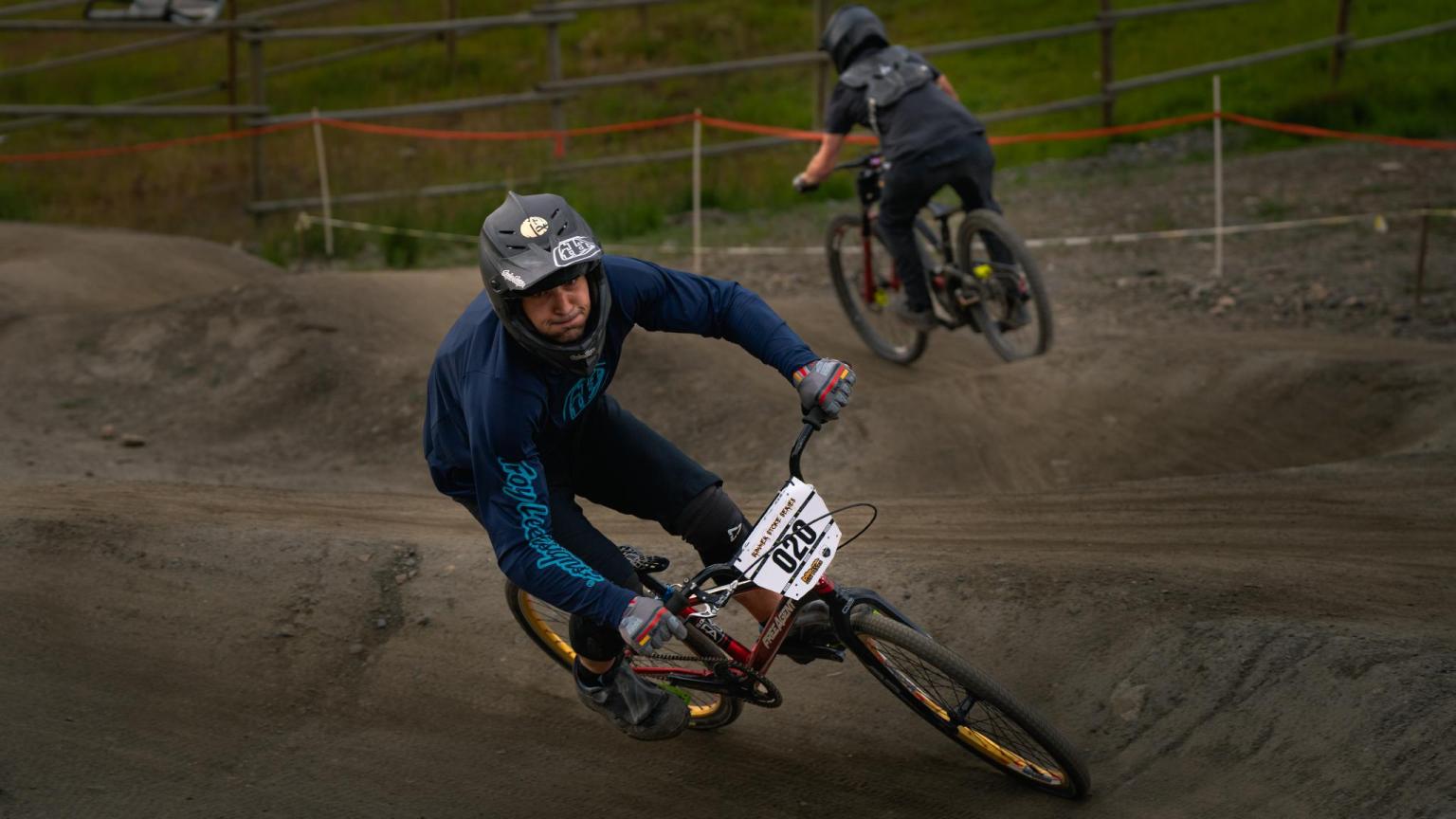 Two bikers racing round the pump track for the Summer Stoke Series Event