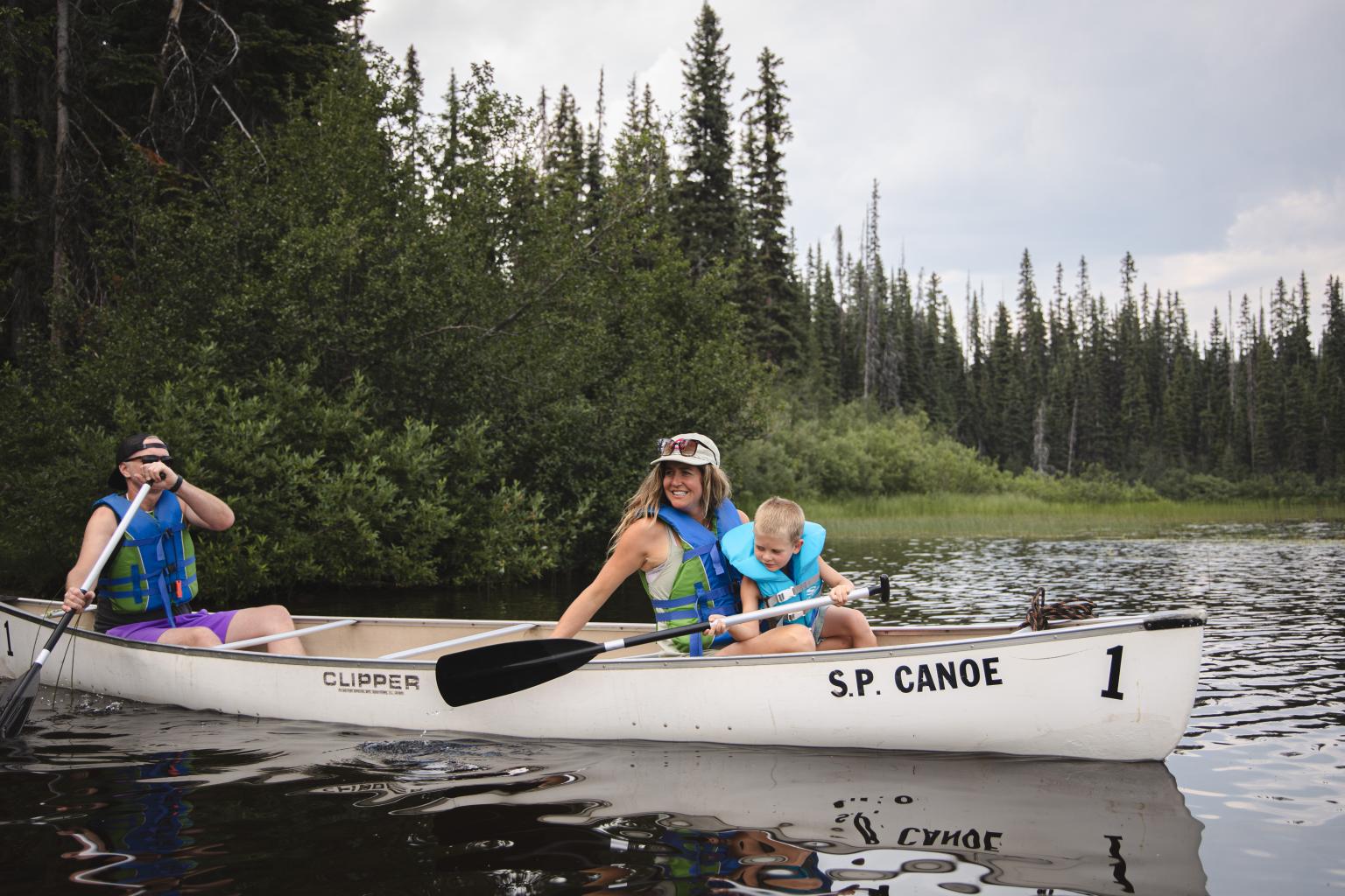 Family in Canoe at McGillivray Lake 