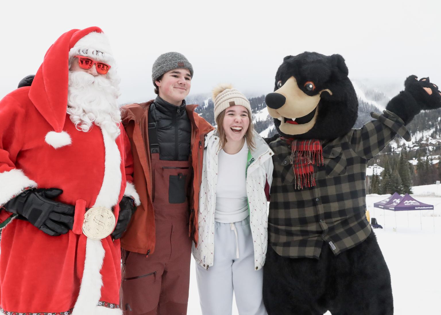 Santa and Harry Bear with a male and a female guest