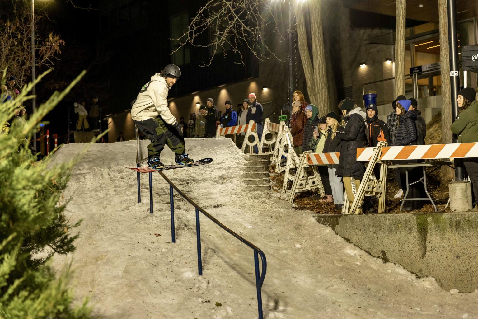 Snowboarder riding a rail at TRU