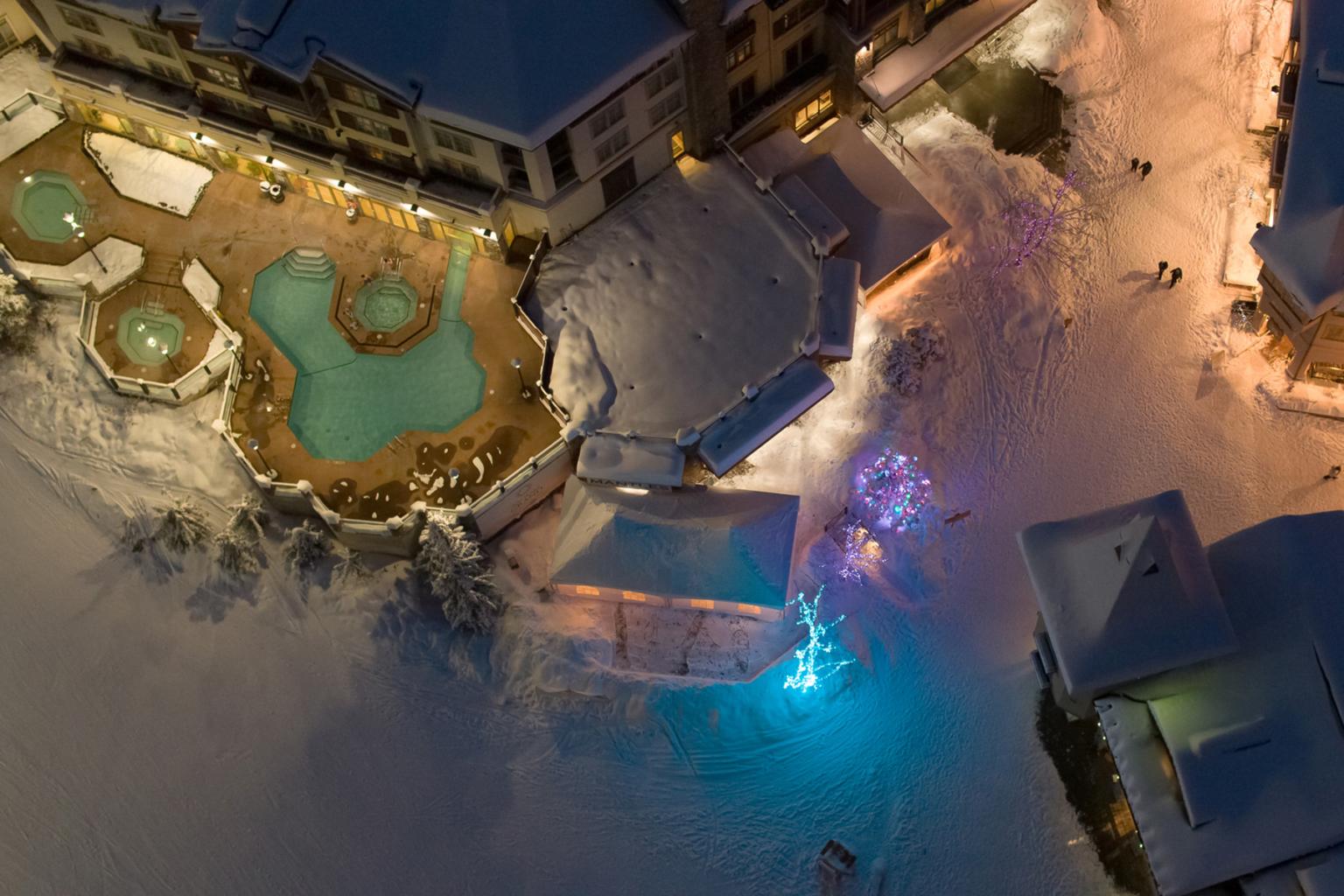 Aerial view of Sun Peaks Grand Hotel pool area and village