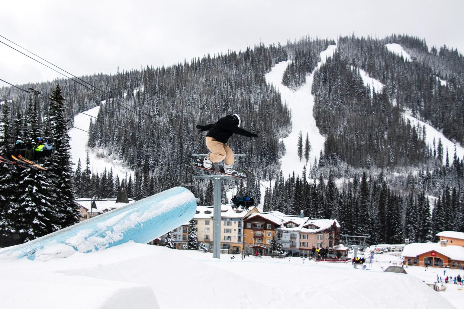 Terrain Park photo of Snowboarder Katie Brayer with village and ski runs in the background