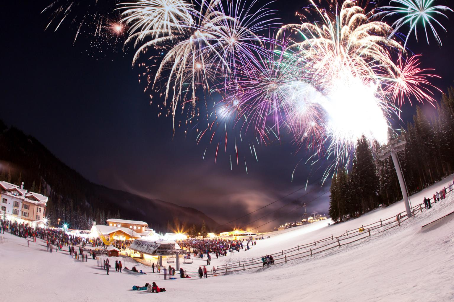 Fireworks going off in the village at night