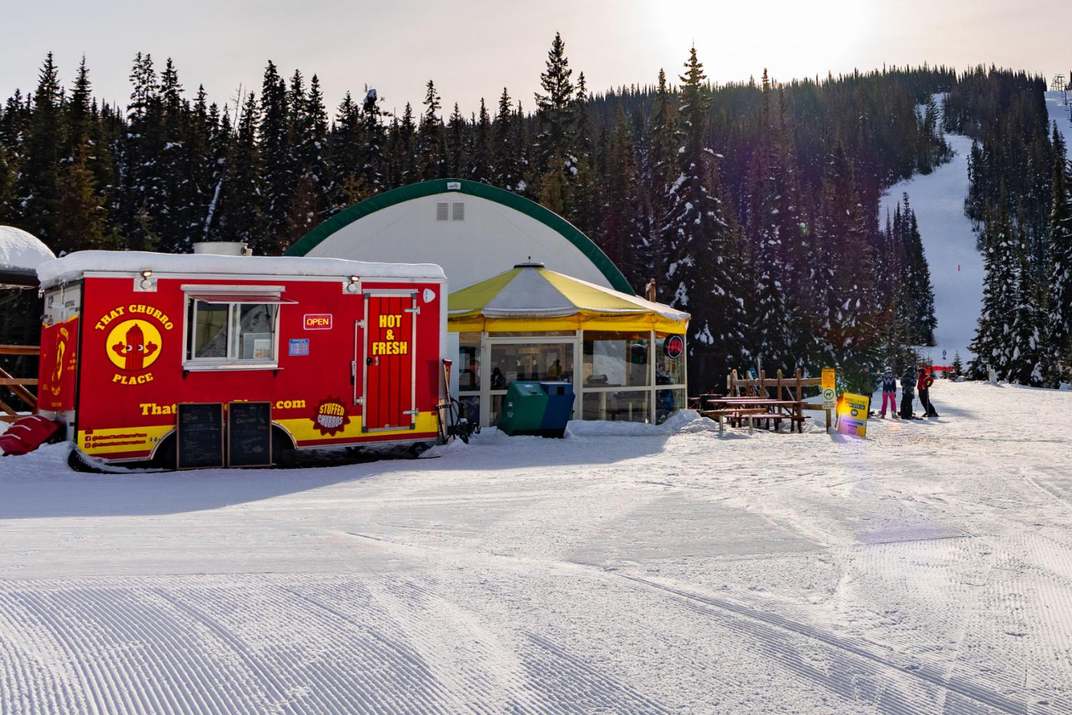 Red That Churro Place truck parked at the base of Morrisey at Sun peaks