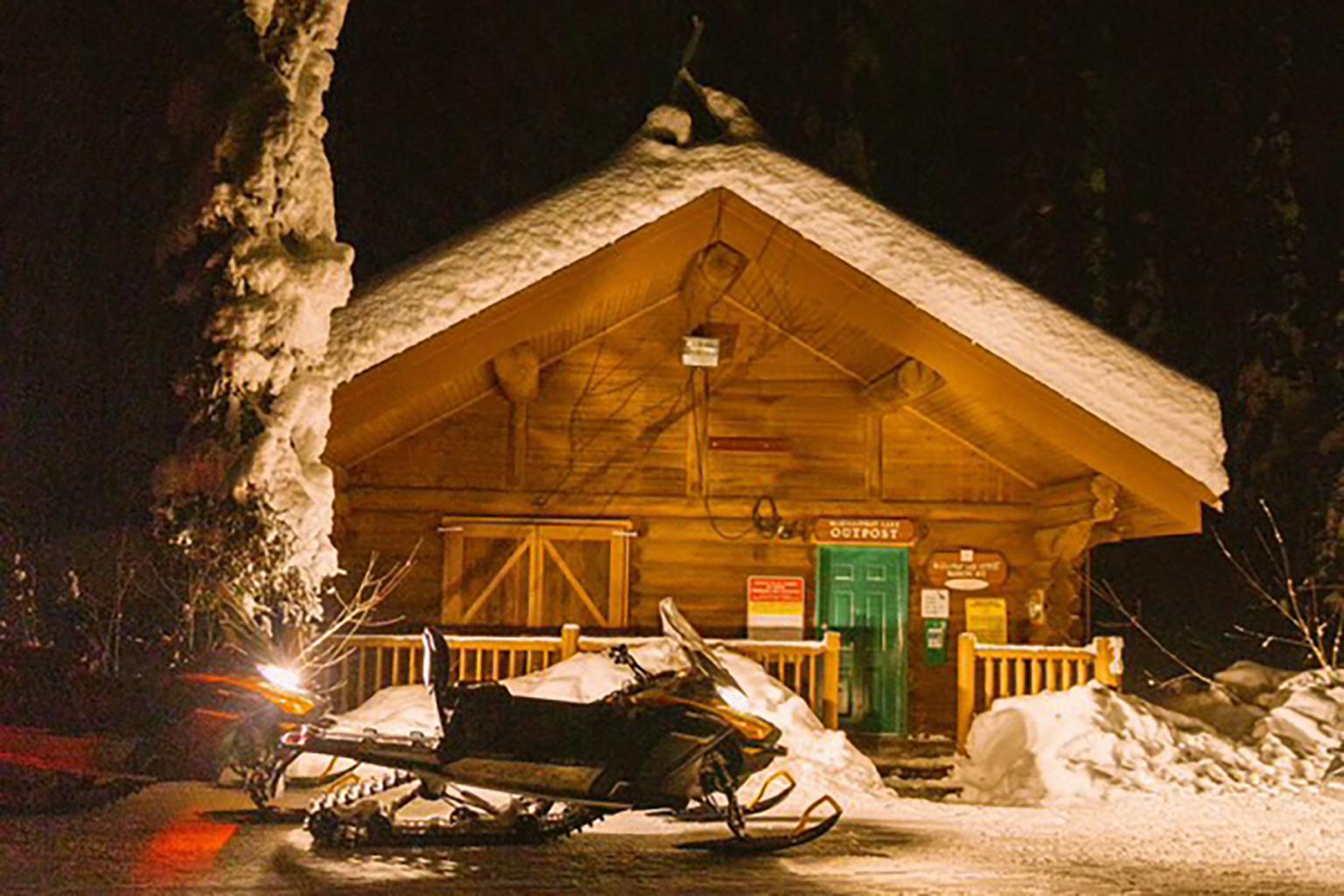 Snowmobile outside McGillivray Lake Cabin