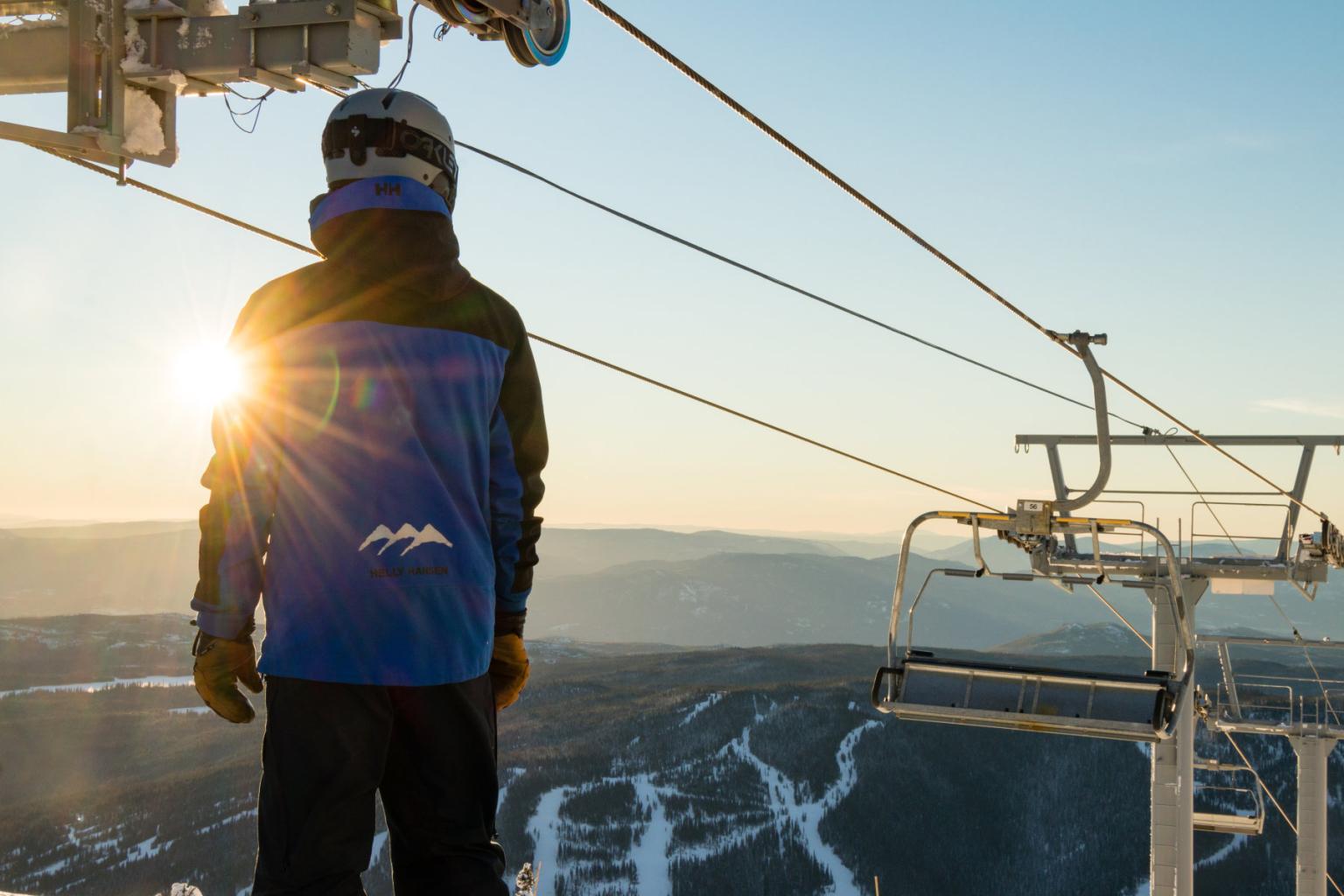 Sun Peaks Resort Employee by a lift with the sunrise