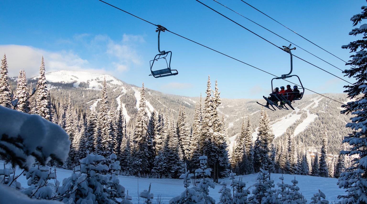 Morrisey chairlift with blue sky and Tod and Sundance mountains in background