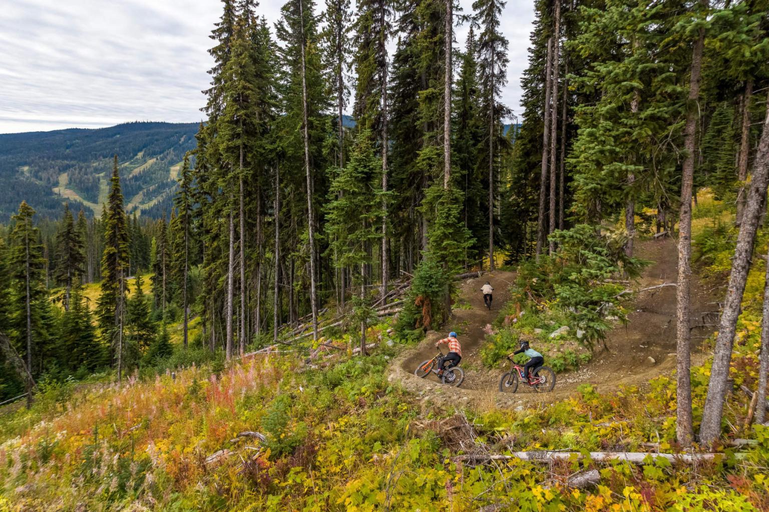 Mountain bikers on Sundance Mountain downhill bike trails in the fall. 