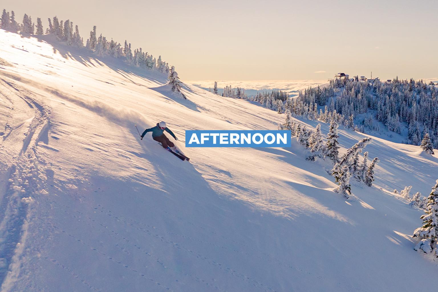 A skier glides down a snowy slope at sunset, with the word “Afternoon” overlaid in bold text.