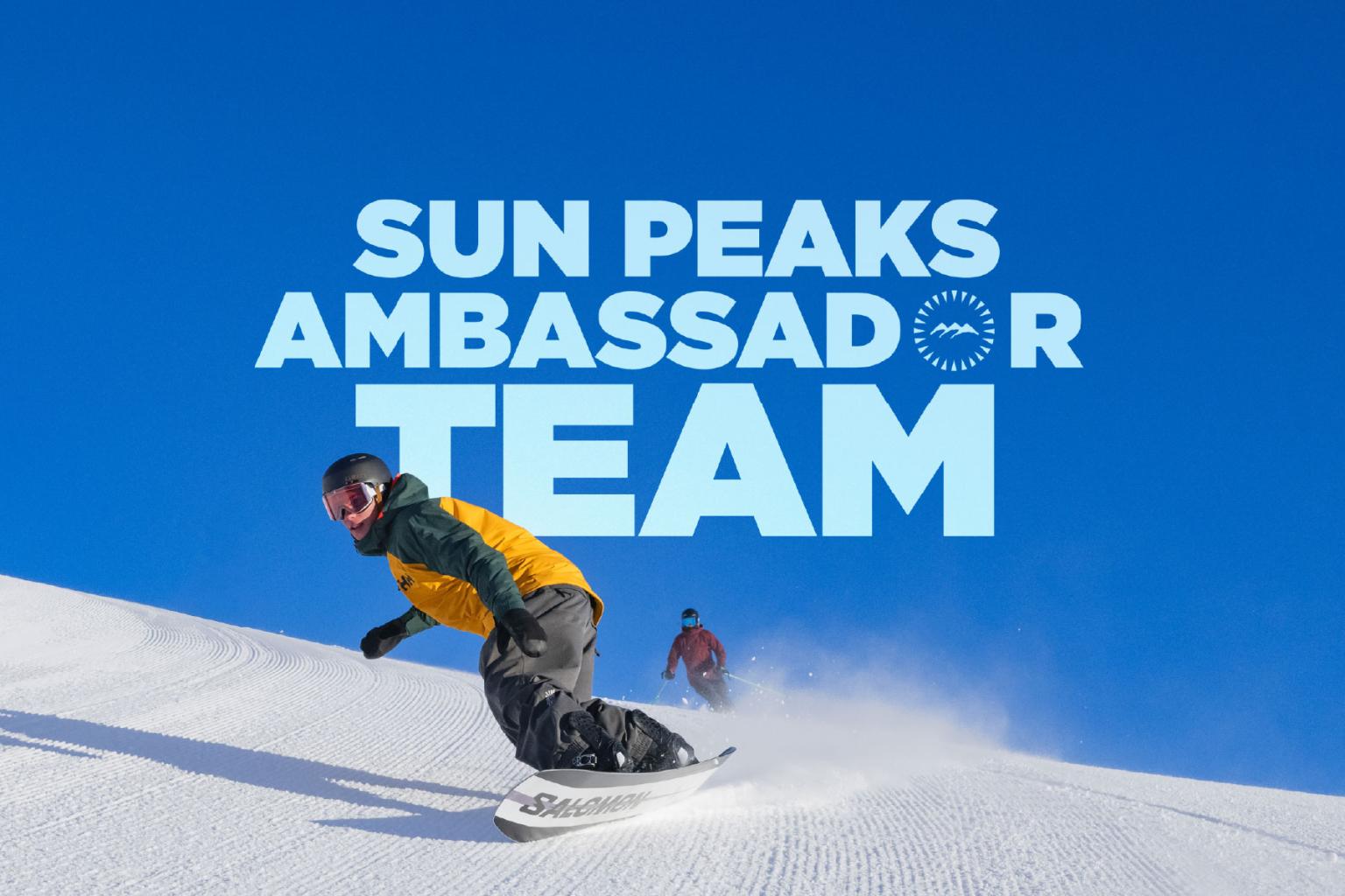 Snowboarder in a yellow jacket carving down a snowy slope under a clear blue sky. Text overlay reads ‘Sun Peaks Ambassador Team.'
