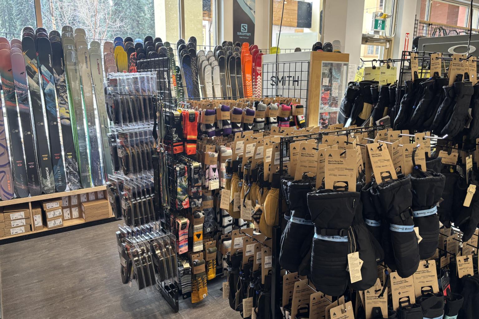 Ski poles and gloves displayed in a store.