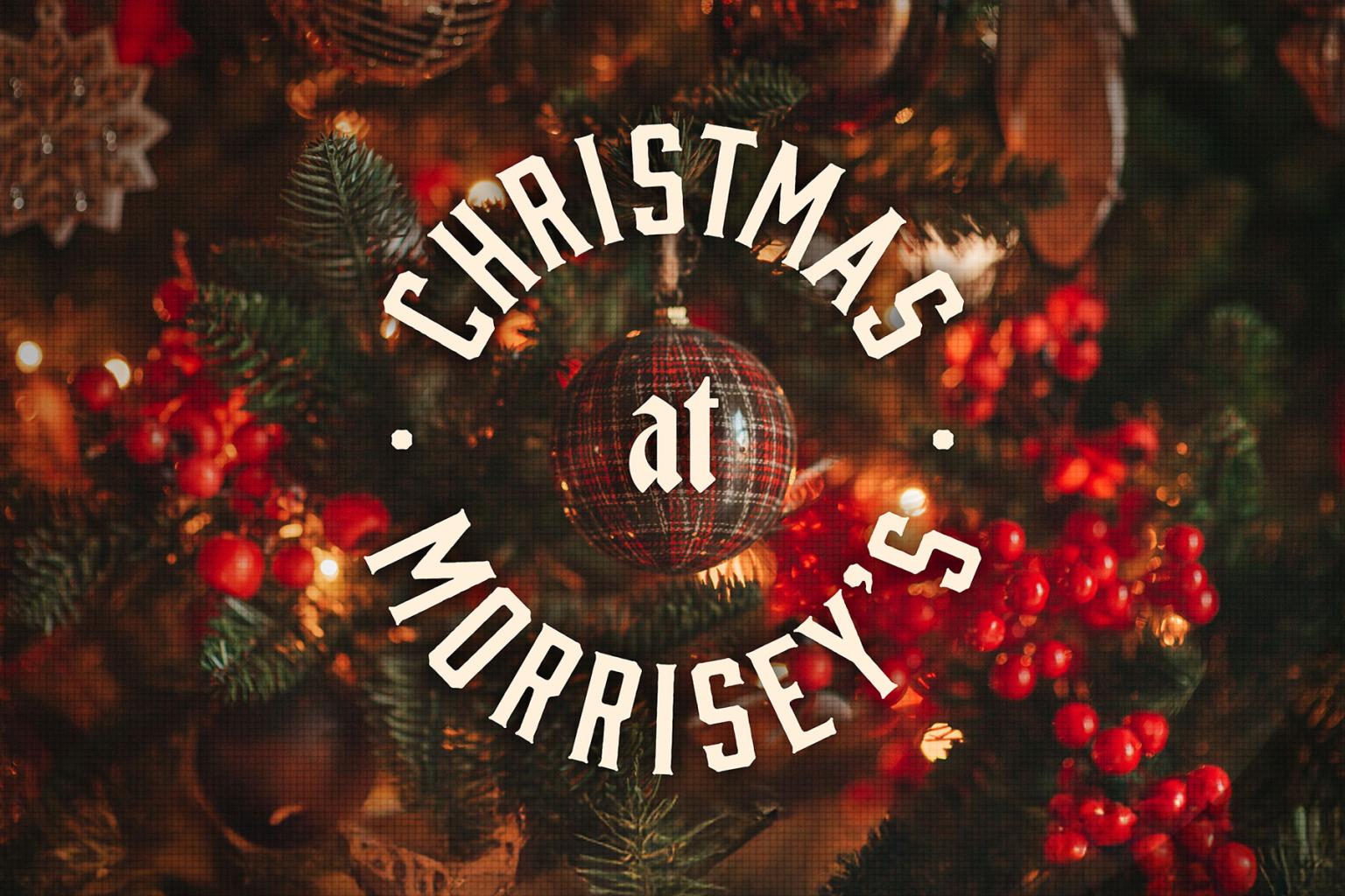 Festive Christmas tree with red berries and pinecones. Text overlay reads Christmas at Morrisey's.